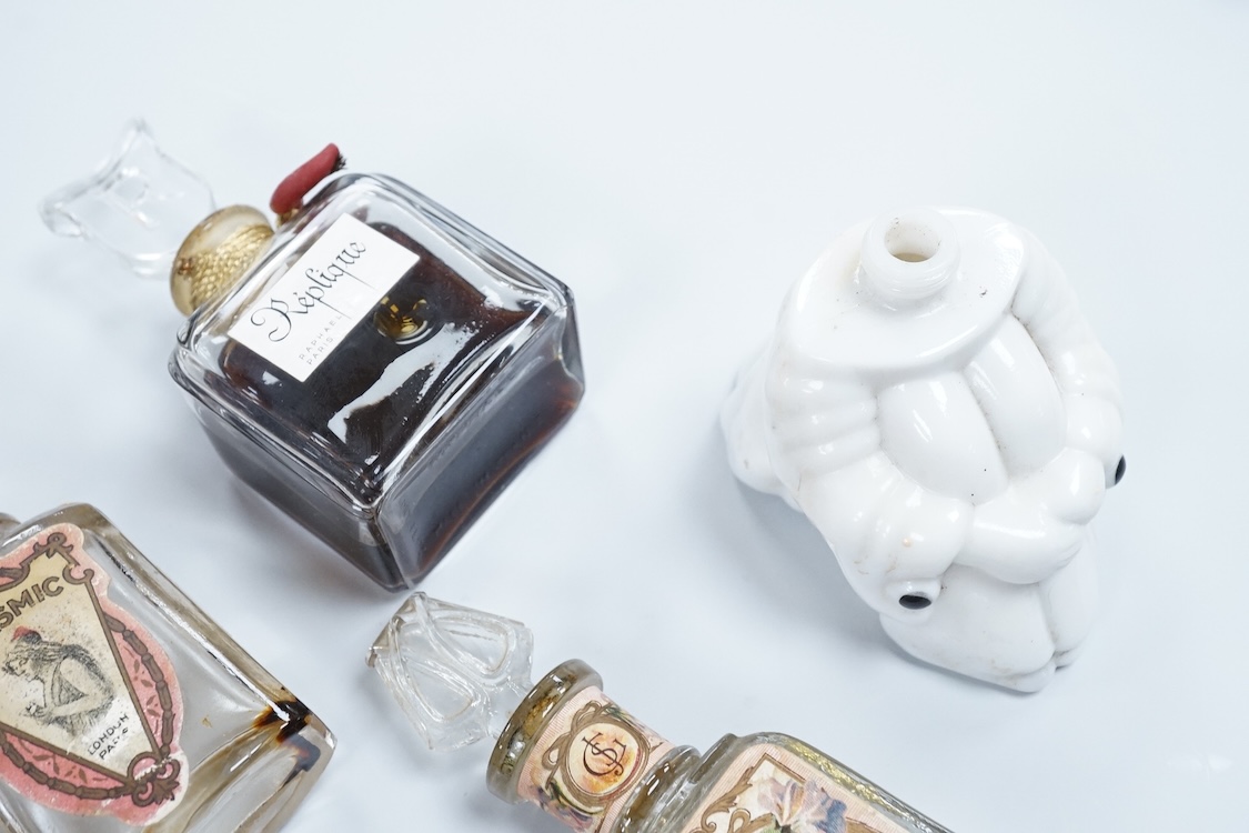 A Baccarat Guerlain perfume bottle in original box and a collection of other empty perfume bottles